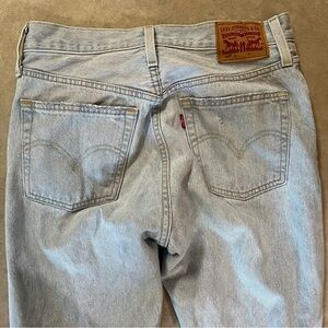 Levi's 501 Light Blue Denim Jeans. Button fly. Rips. Size 27. Leg 28. Like new